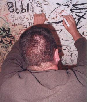 Roger writing on the ceiling.
